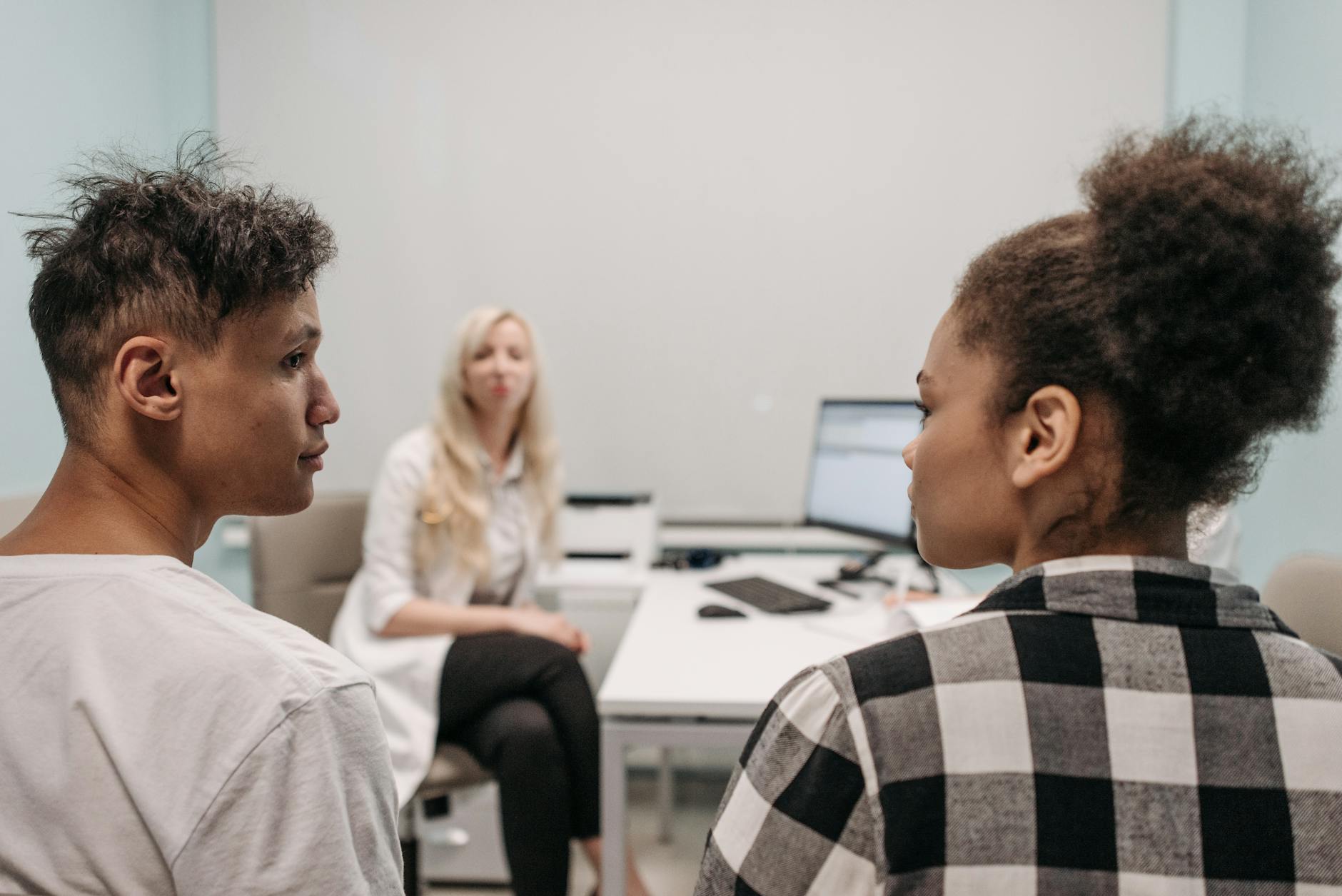 Professional healthcare consultation with diverse patients